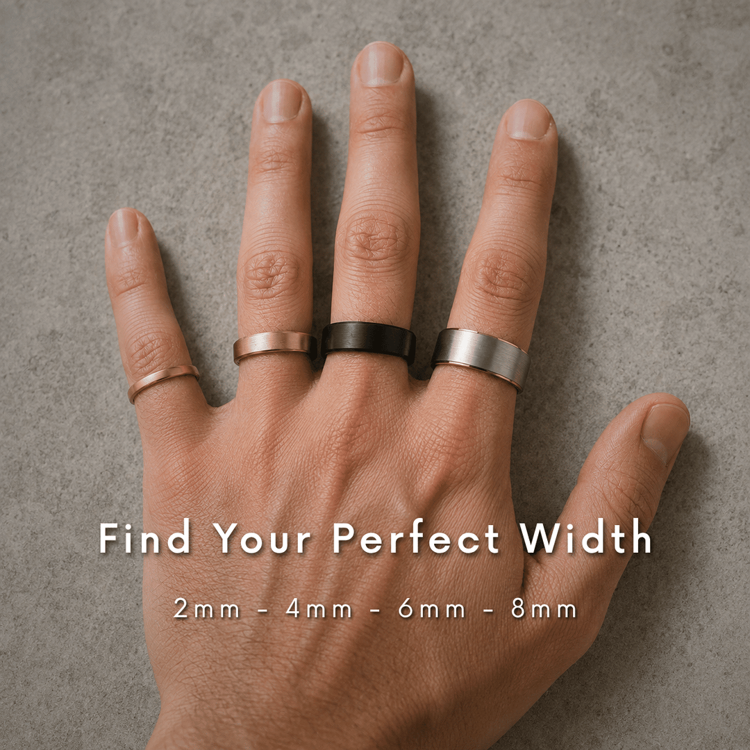Hand wearing four tungsten wedding bands in 2mm, 4mm, 6mm, and 8mm widths in rose gold, yellow gold, black, and silver.
