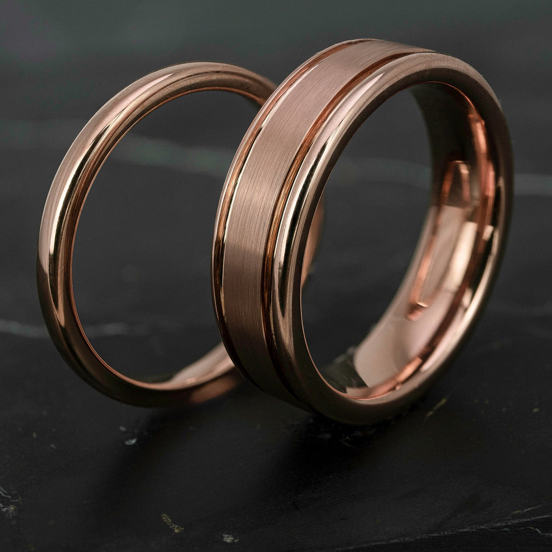 His and hers polished rose gold wedding bands in 2mm and 6mm widths, featuring a smooth high shine finish and matching minimalist design.