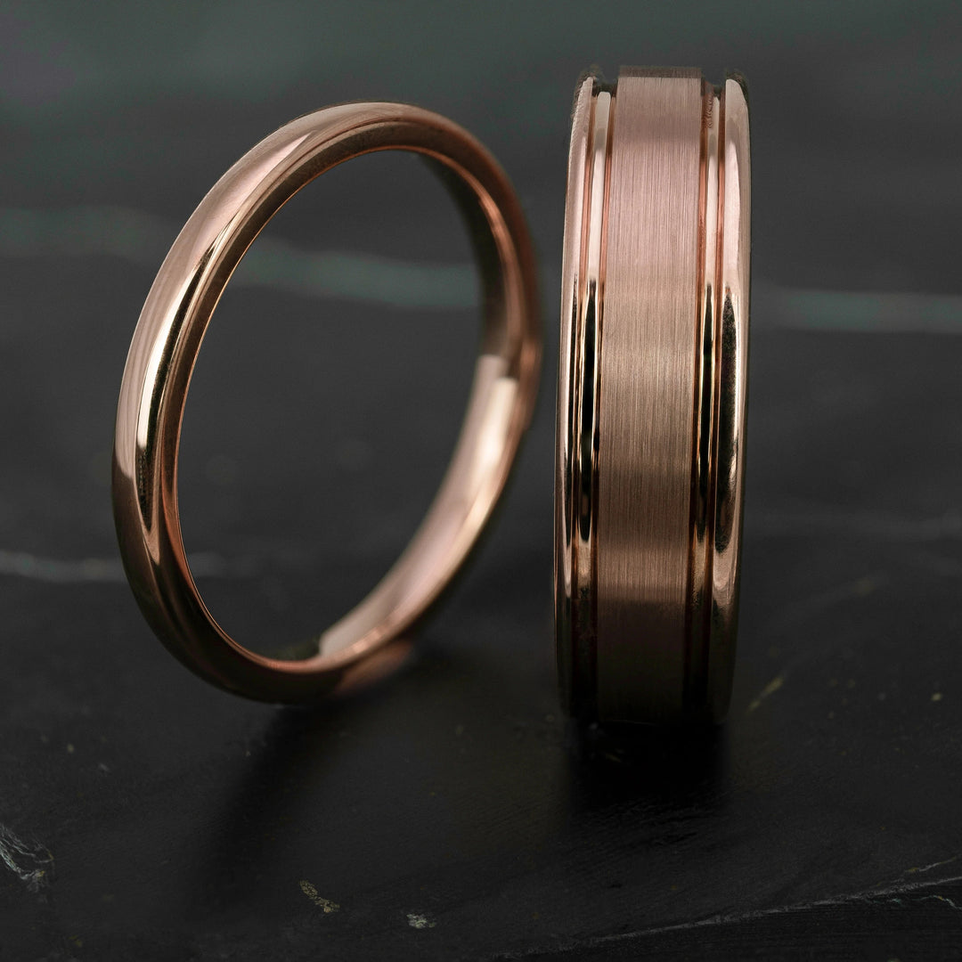 His and hers polished rose gold wedding bands in 2mm and 6mm widths, featuring a smooth high shine finish and matching minimalist design.
