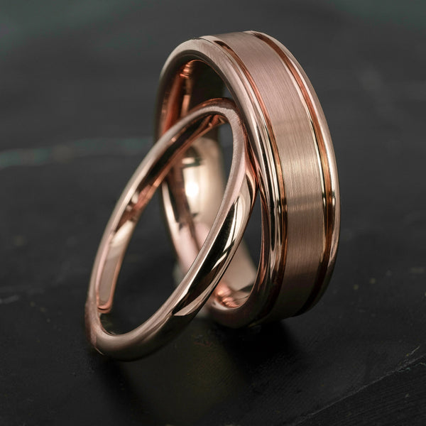 His and hers polished rose gold wedding bands in 2mm and 6mm widths, featuring a smooth high shine finish and matching minimalist design.